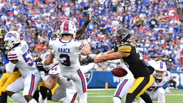 Steelers safety Miles Killebrew (28) blocks a punt by Buffalo Bills punter Matt Haack (3) in the fourth quarter of a game at Highmark Stadium.